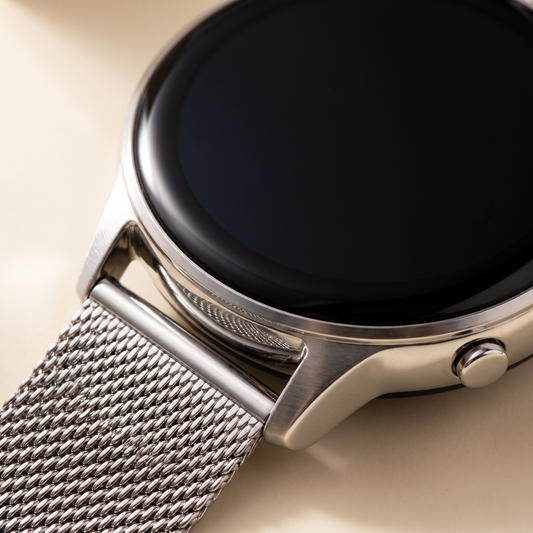 Close-up of the bezel and woven mesh strap on the TrueSelf smart watch